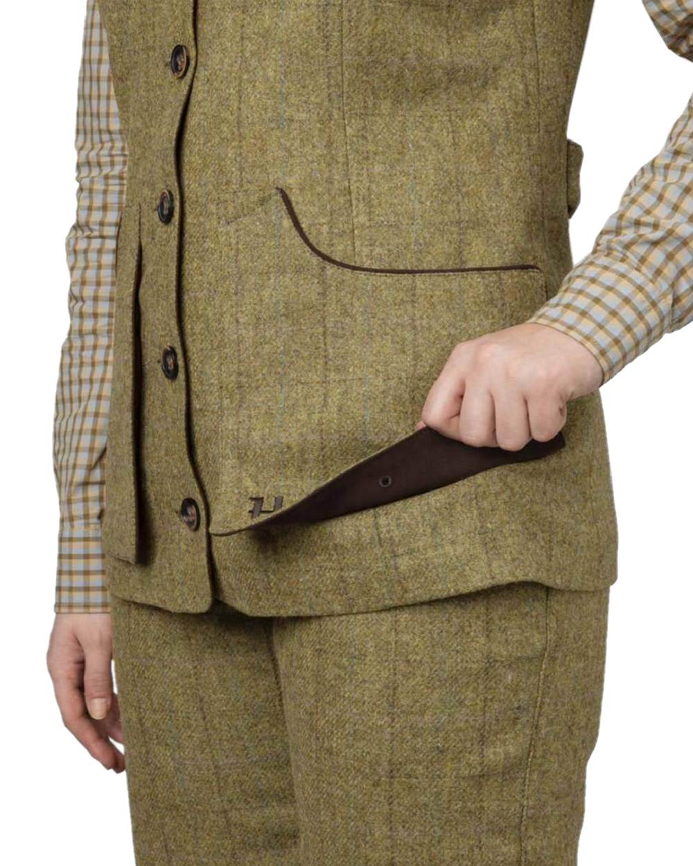 Olive Coloured Harkila Womens Jura Shooting Waistcoat on white background #colour_olive