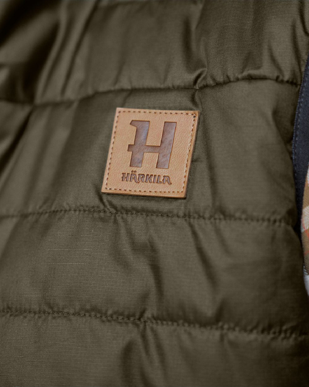 Willow Green Arabian Spice Coloured Harkila Womens Kalix HSP Waistcoat on blurry background #colour_willow-green-arabian-spice