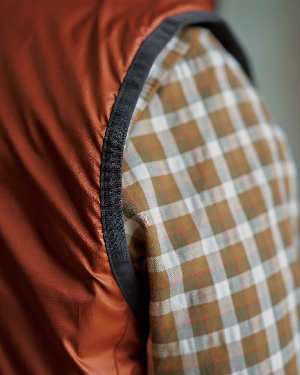 Willow Green Arabian Spice Coloured Harkila Womens Kalix HSP Waistcoat on blurry background #colour_willow-green-arabian-spice