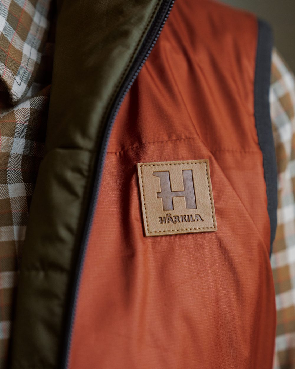 Willow Green Arabian Spice Coloured Harkila Womens Kalix HSP Waistcoat on blurry background #colour_willow-green-arabian-spice