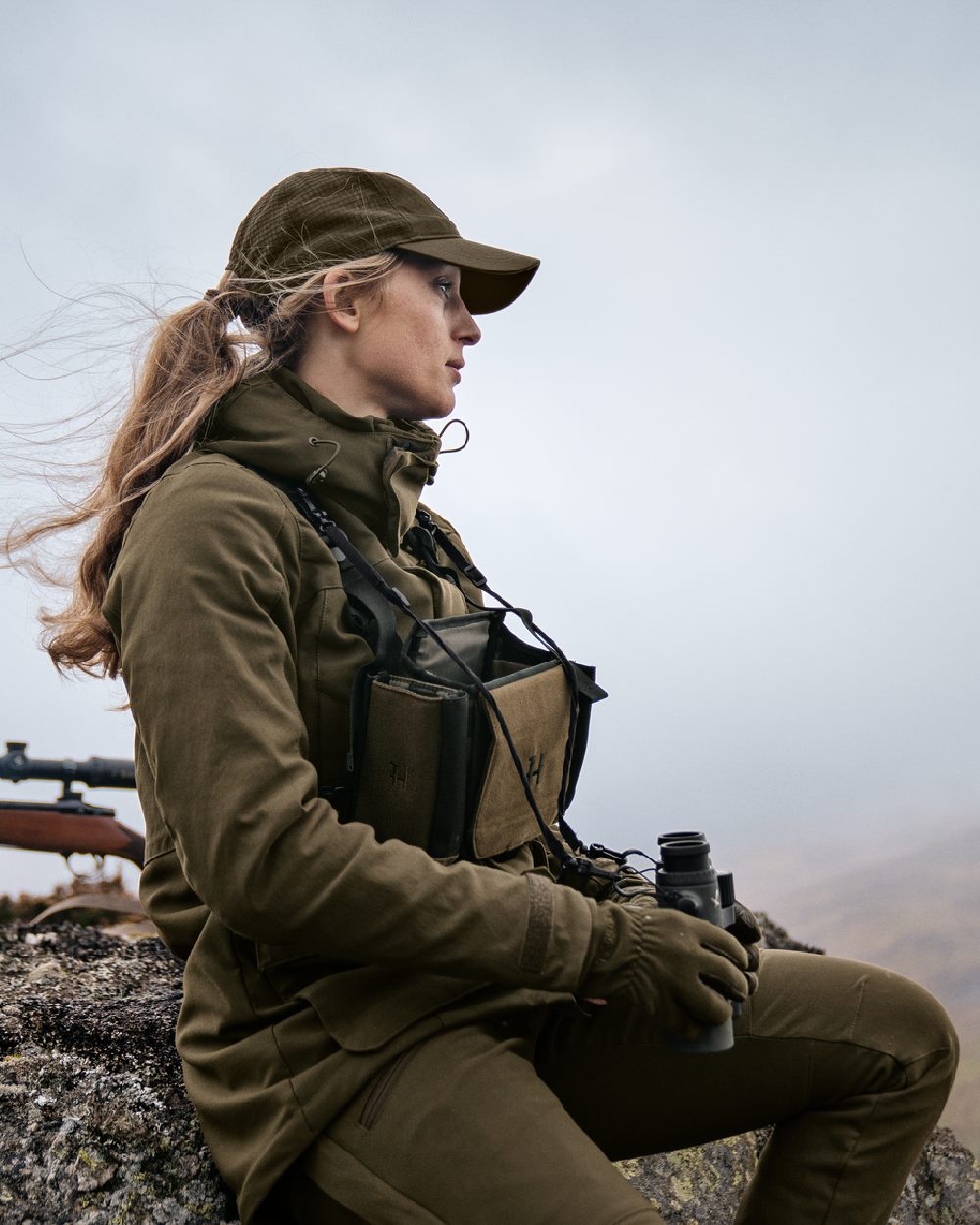 Willow Green Coloured Harkila Womens Pro Hunter GTX Jacket on mountain background #colour_willow-green