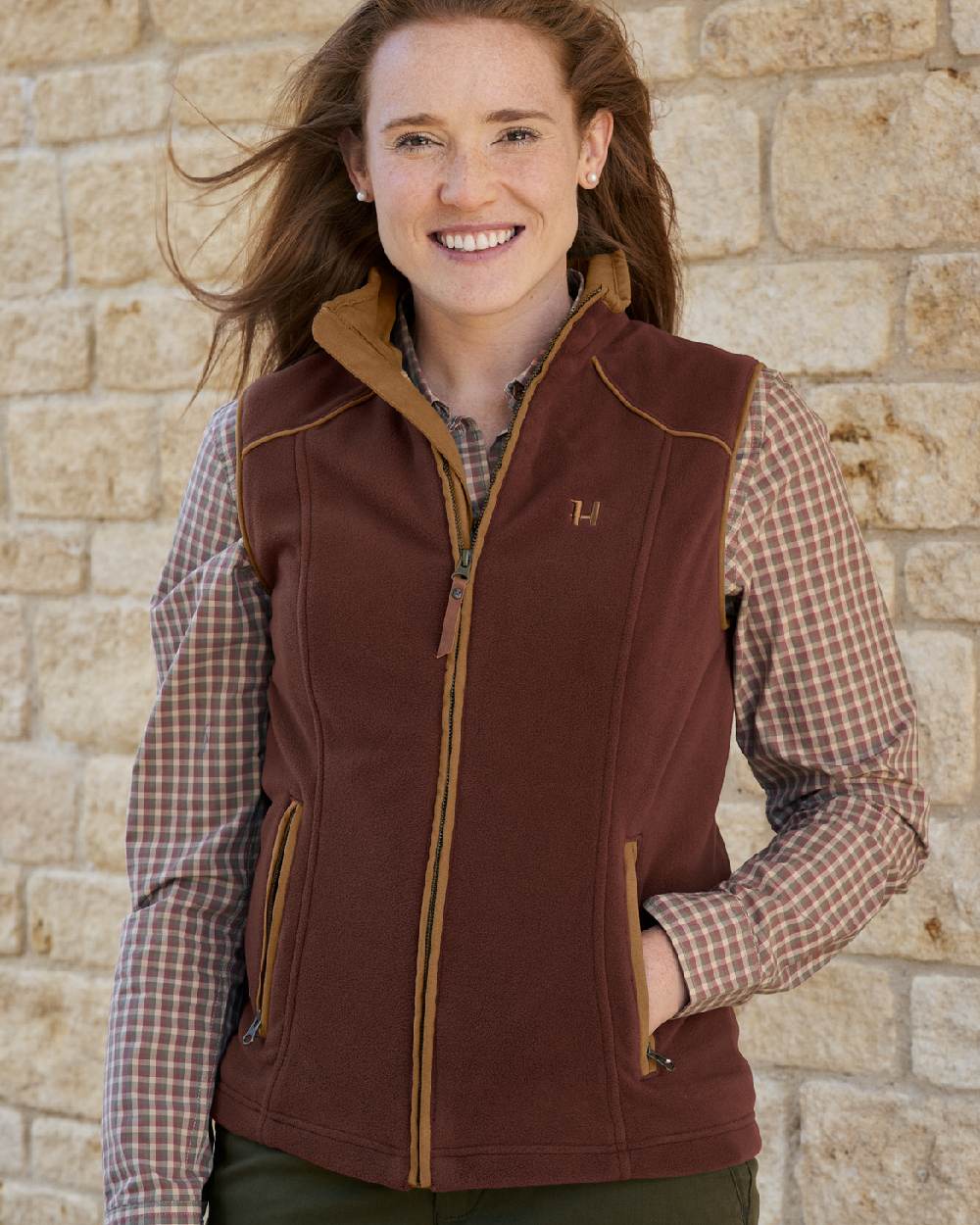 Burgundy Coloured Harkila Womens Sandhem 200 Fleece Waistcoat on outdoor background #colour_burgundy