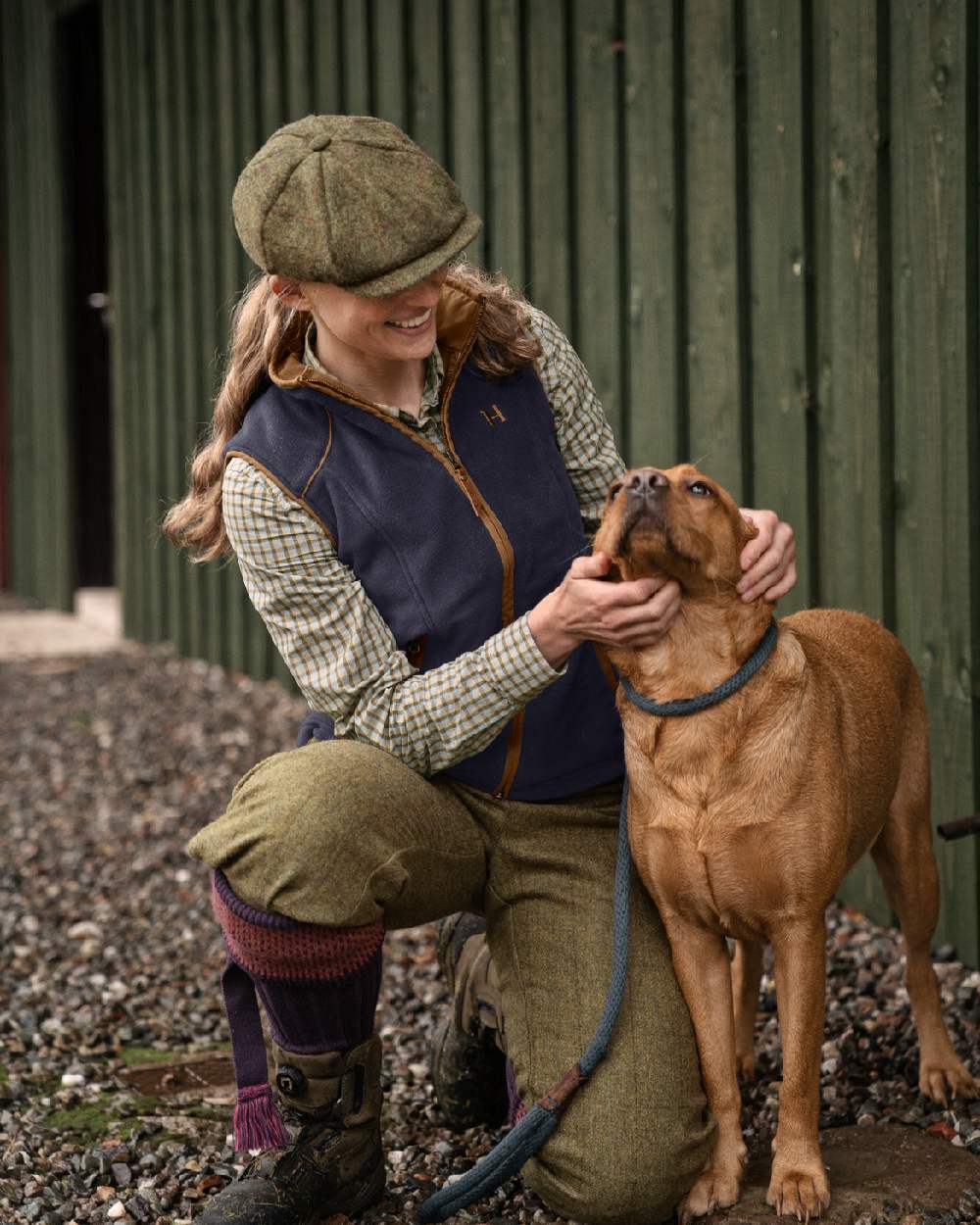 Deep Well Purple Coloured Harkila Womens Sandhem 200 Fleece Waistcoat on outdoor background #colour_deep-well-purple