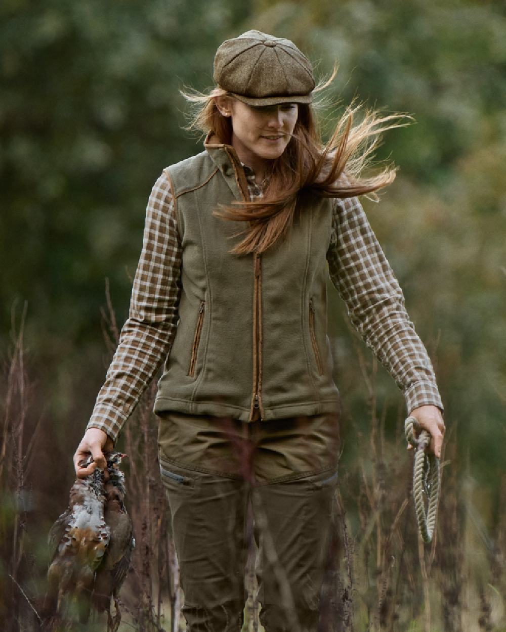 Grape Leaf Coloured Harkila Womens Sandhem 200 Fleece Waistcoat on outdoor background #colour_grape-leaf