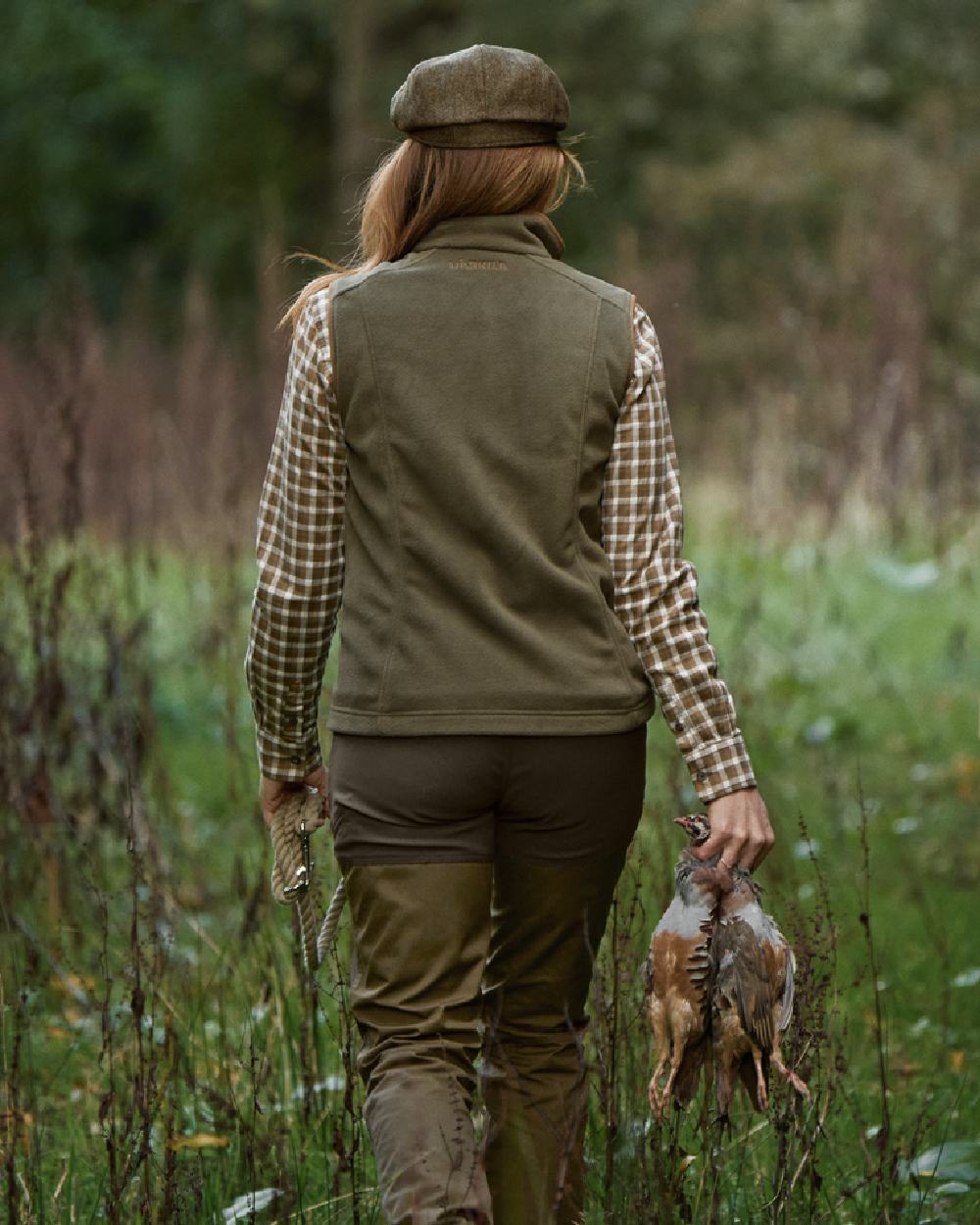 Grape Leaf Coloured Harkila Womens Sandhem 200 Fleece Waistcoat on outdoor background #colour_grape-leaf