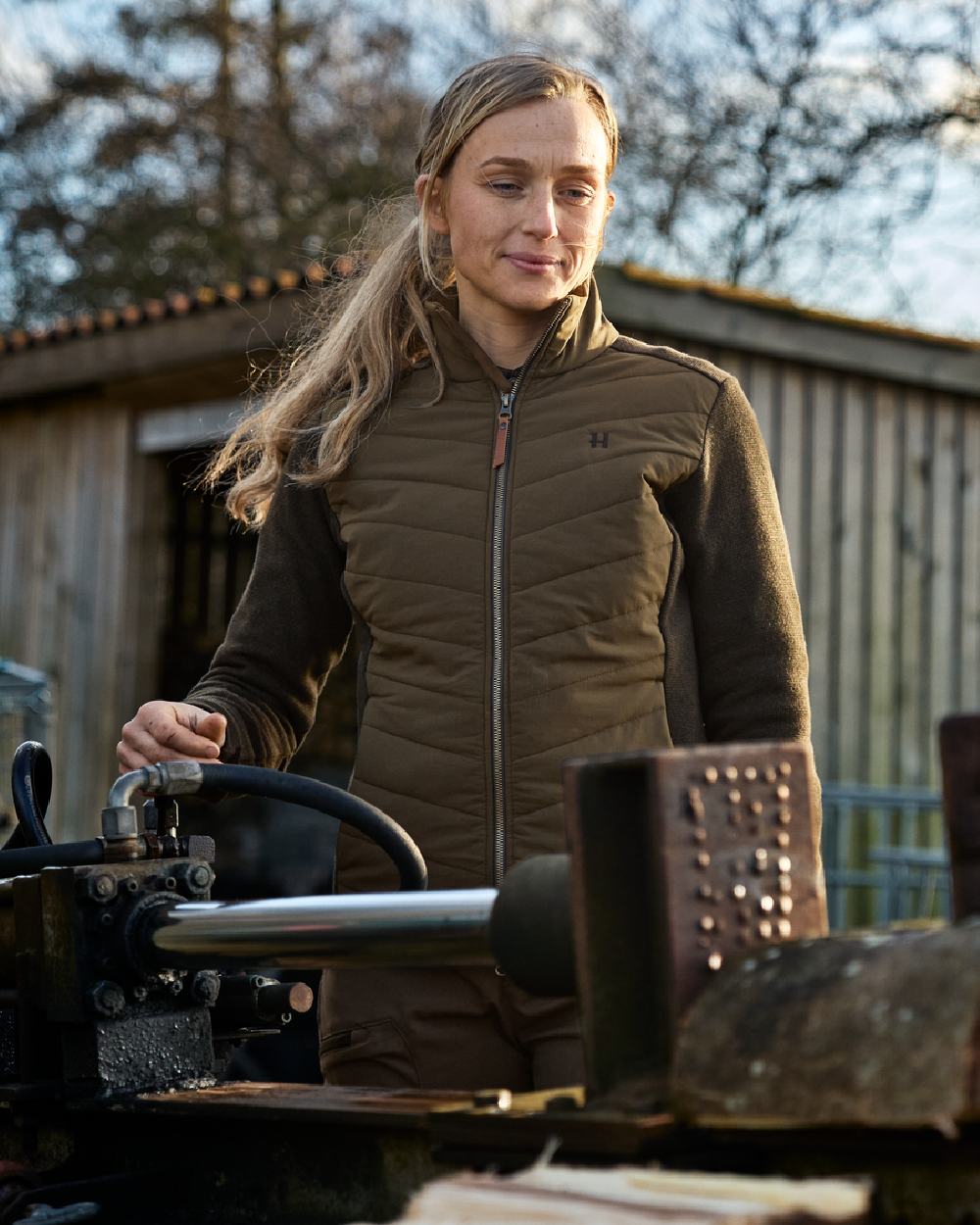 Willow Green Coloured Harkila Womens Sandhem Pro Insulated Cardigan on countryside background #colour_willow-green