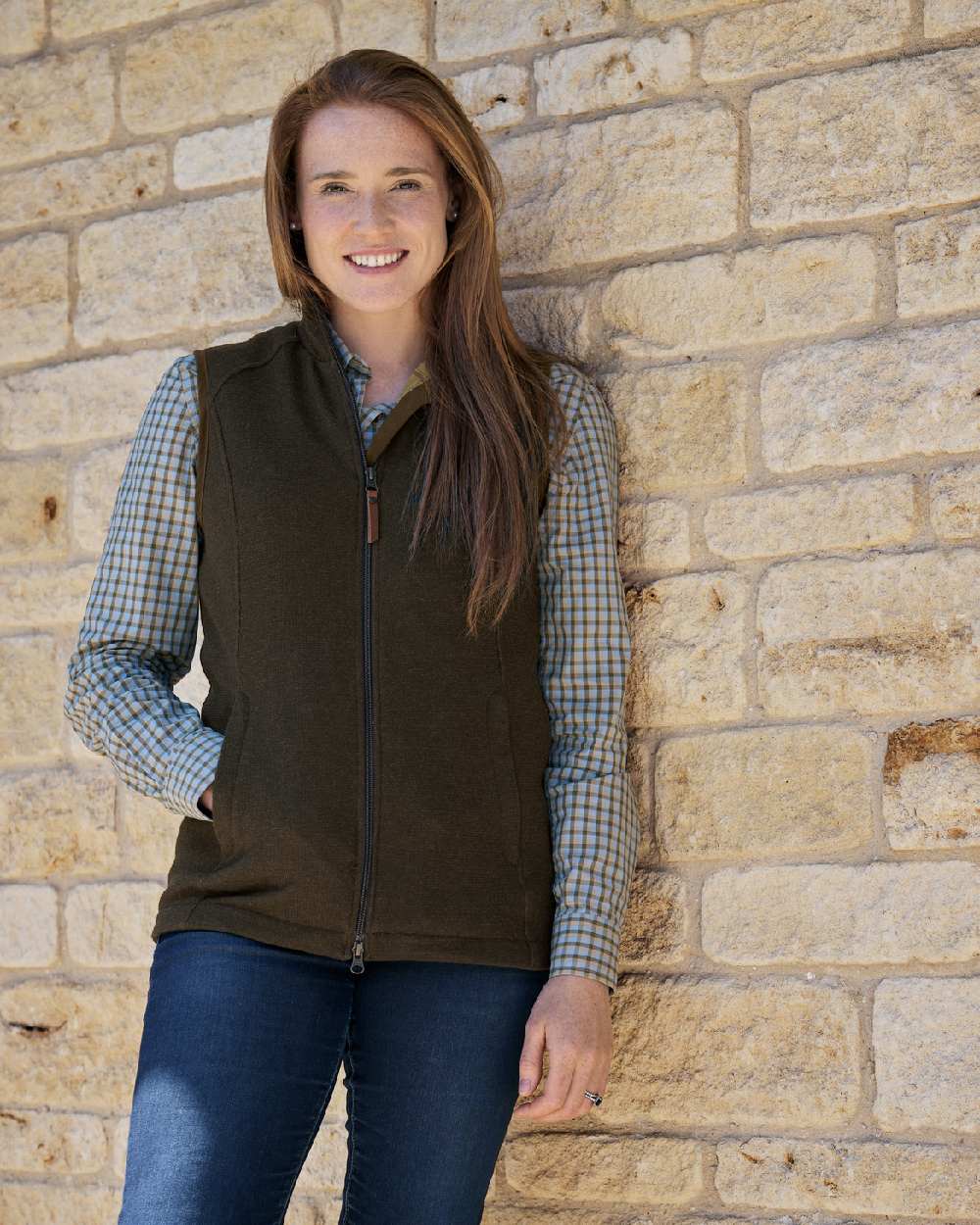 Forest Green Coloured Harkila Womens Sandhem Pro Waistcoat on wall background #colour_forest-green