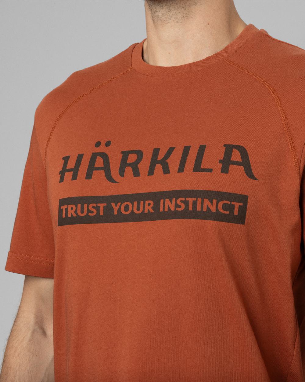 Arabian Spice Coloured Harkila logo Short Sleeve T-Shirt on outdoor background #colour_arabian-spice