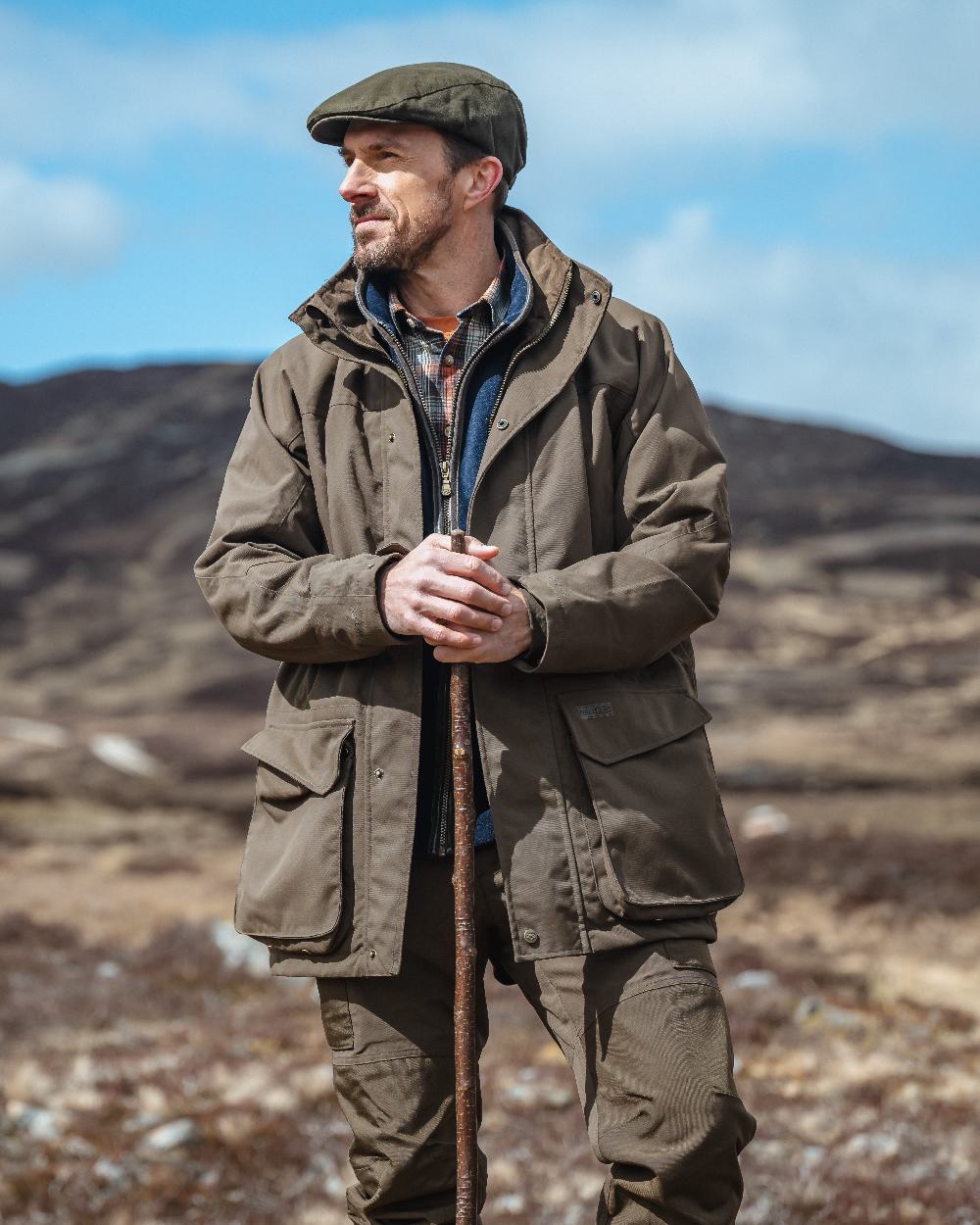 Green Coloured Hoggs of Fife Ballater Waterproof Field Trousers on blurry background #colour_green