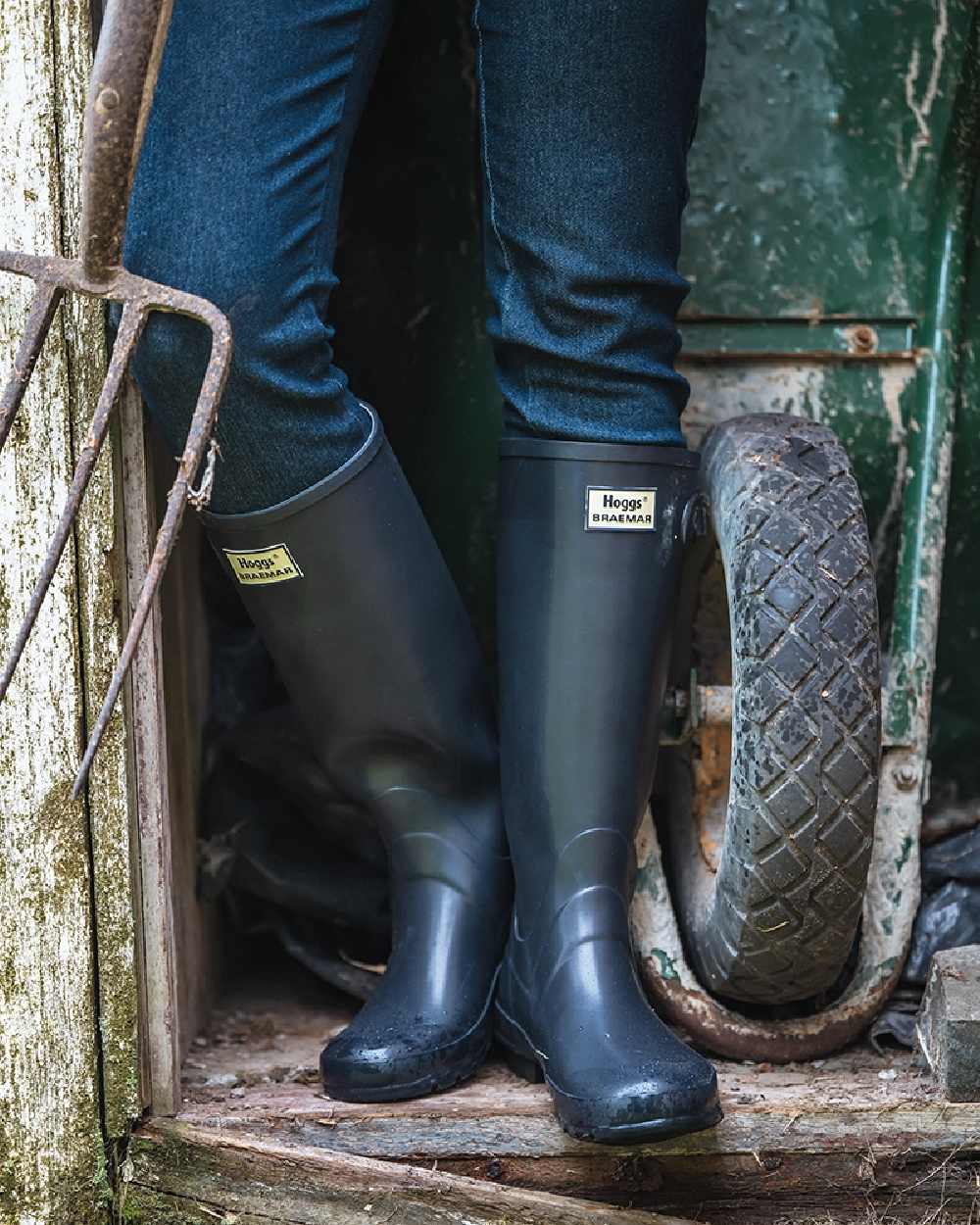 Navy Coloured Hoggs of Fife Braemar Wellingtons on storage room background #colour_navy