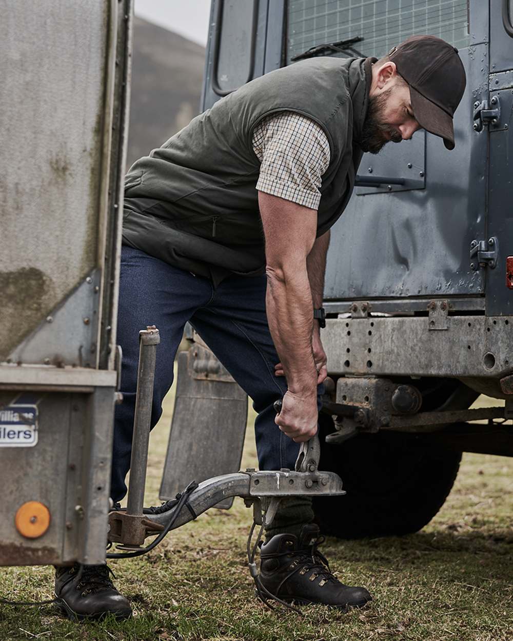 Loden Green Coffee Coloured Hoggs of Fife Breezer II Reversible Bodywarmer on truck background #colour_loden-green-coffee