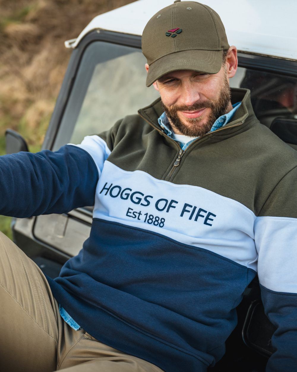 Forest White Navy Coloured Hoggs of Fife Dumfries 1888 Mens Quarter Zip Sweatshirt on car background #colour_forest-white-navy