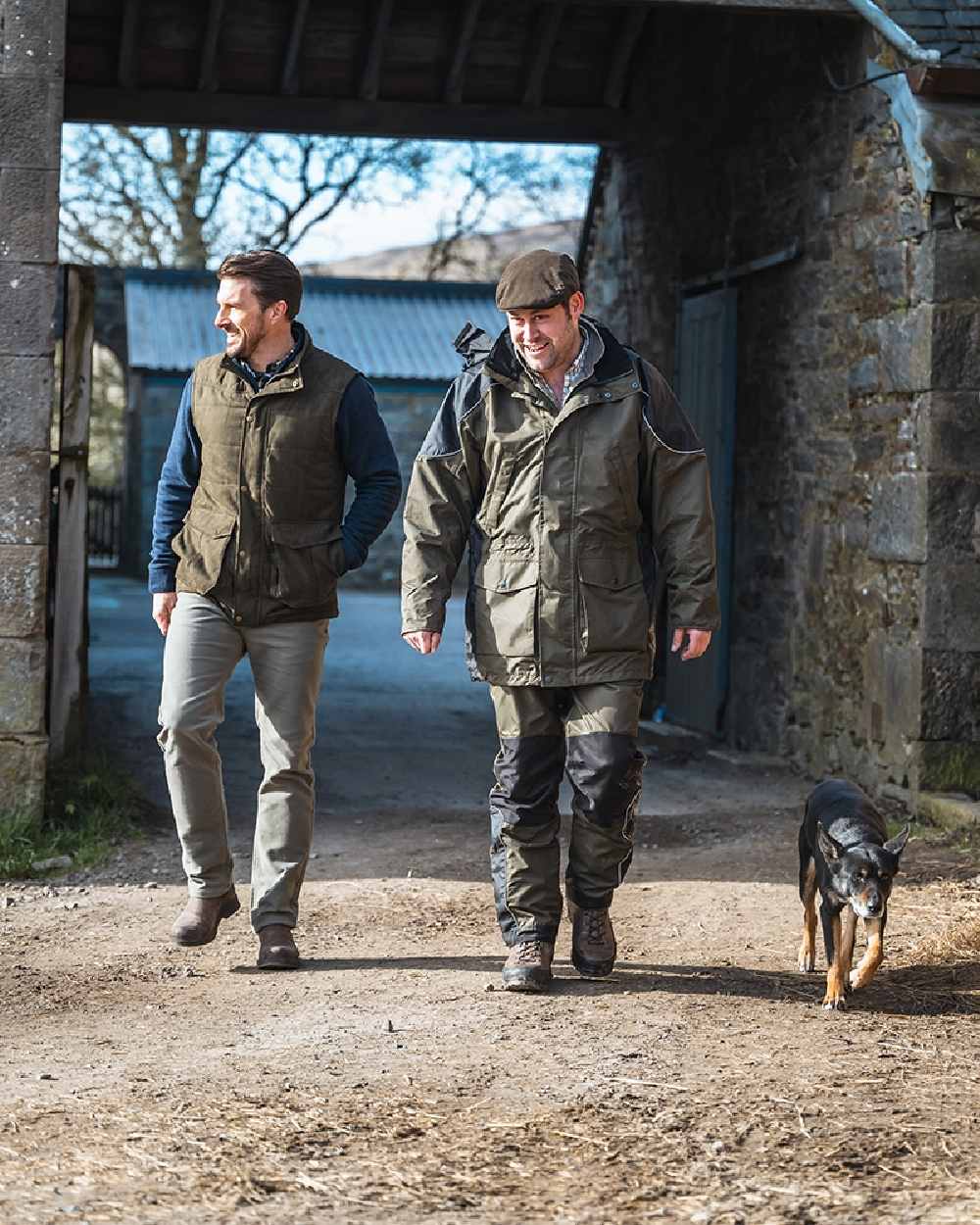 Green Coloured Hoggs of Fife Field Tech Waterproof Jacket on house background #colour_green