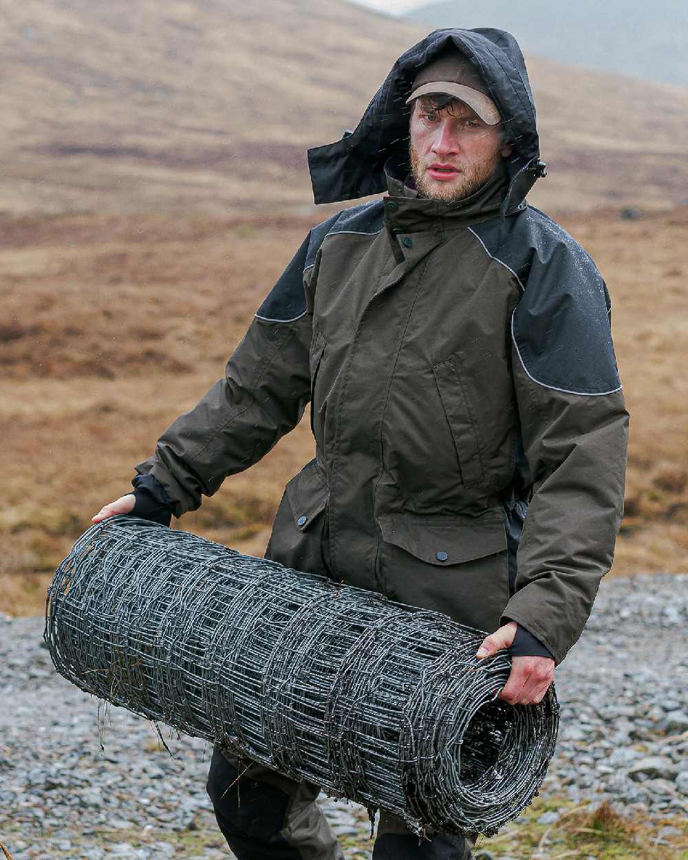 Green Coloured Hoggs of Fife Field Tech Waterproof Jacket on land background #colour_green
