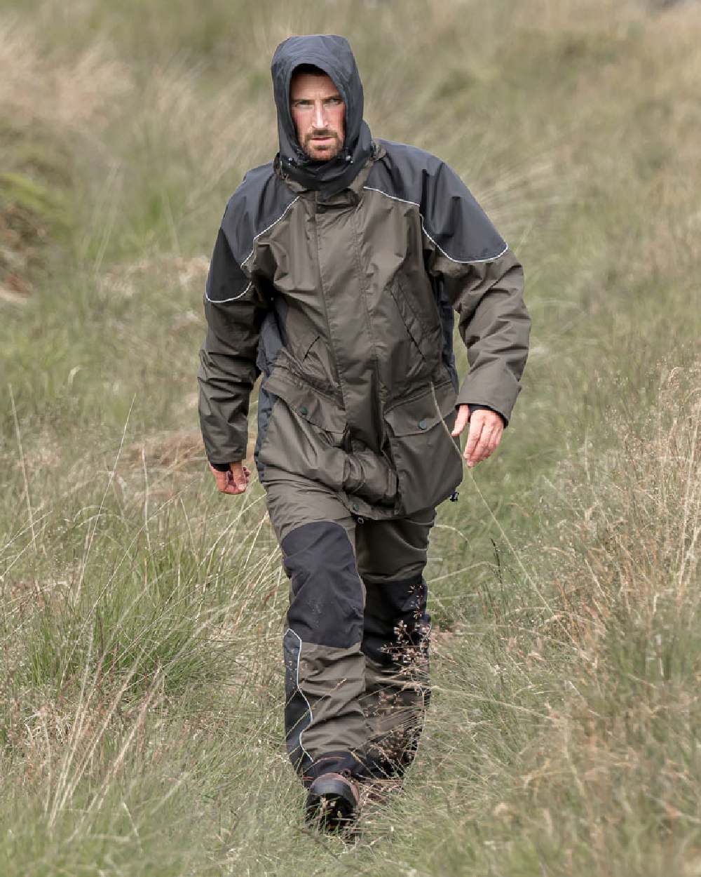 Green Coloured Hoggs of Fife Field Tech Waterproof Jacket on grass background #colour_green
