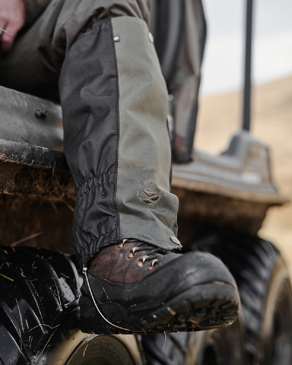 Green Black Coloured Hoggs of Fife Field & Trek Gaiters on blurry background #colour_green-black