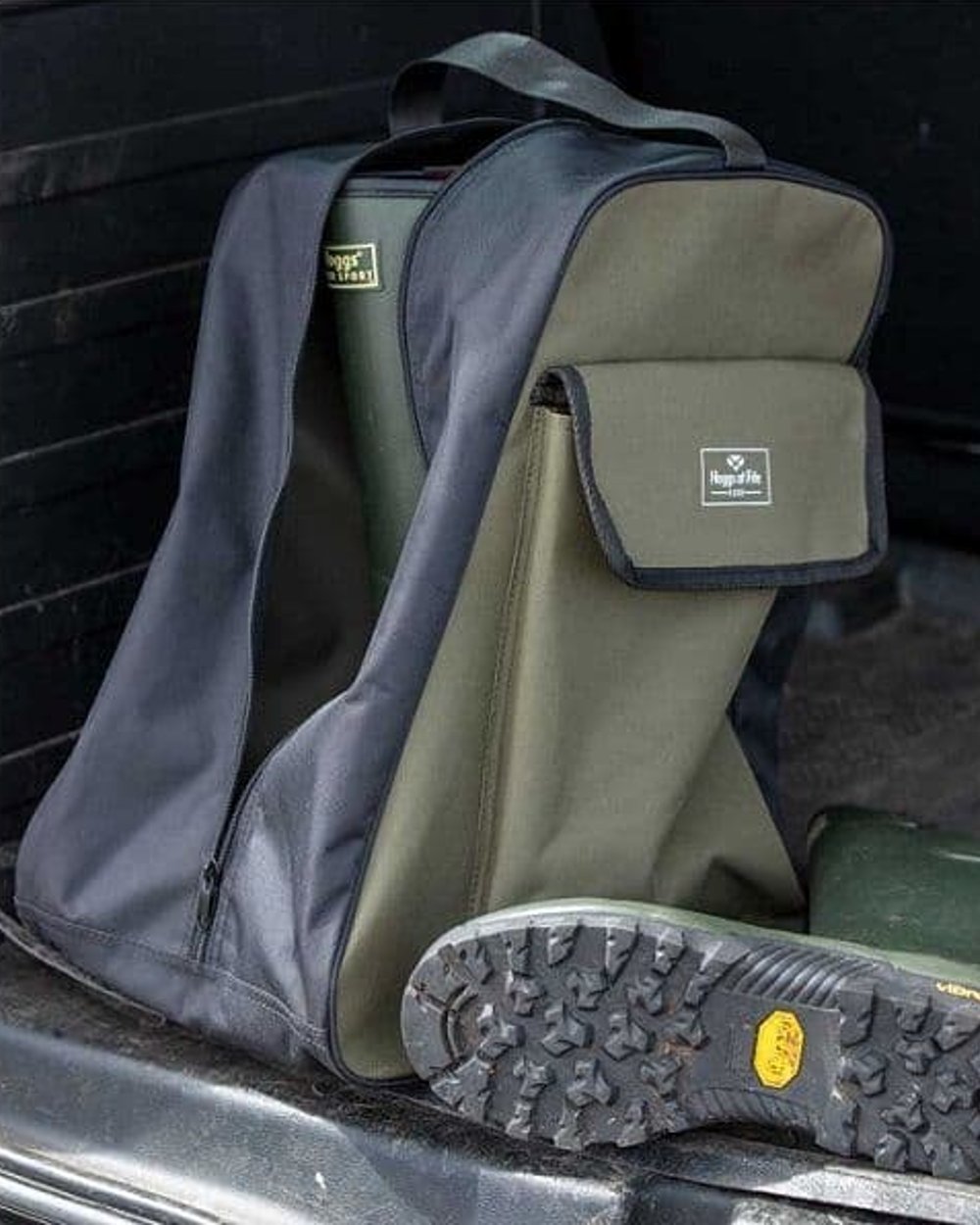 Green Black Coloured Hoggs of Fife Field & Trek Boot Bag on car background #colour_green-black