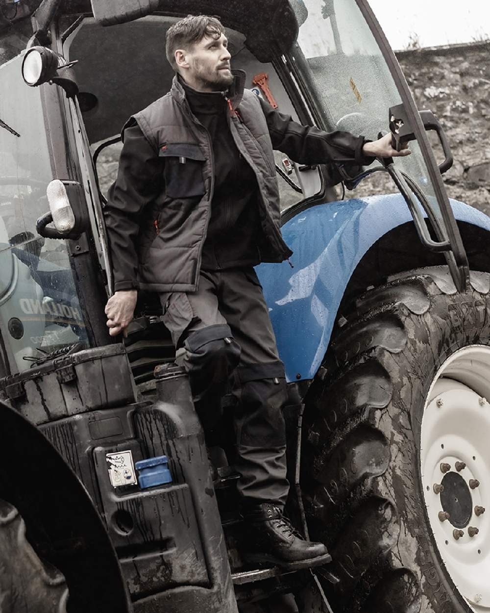 Charcoal Black Coloured Hoggs of Fife Granite II Utility Thermal Trousers on tractor background #colour_charcoal-black