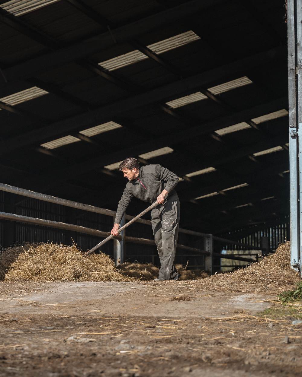 Green Coloured Hoggs of Fife Green King II Waterproof Trousers on barn background #colour_green