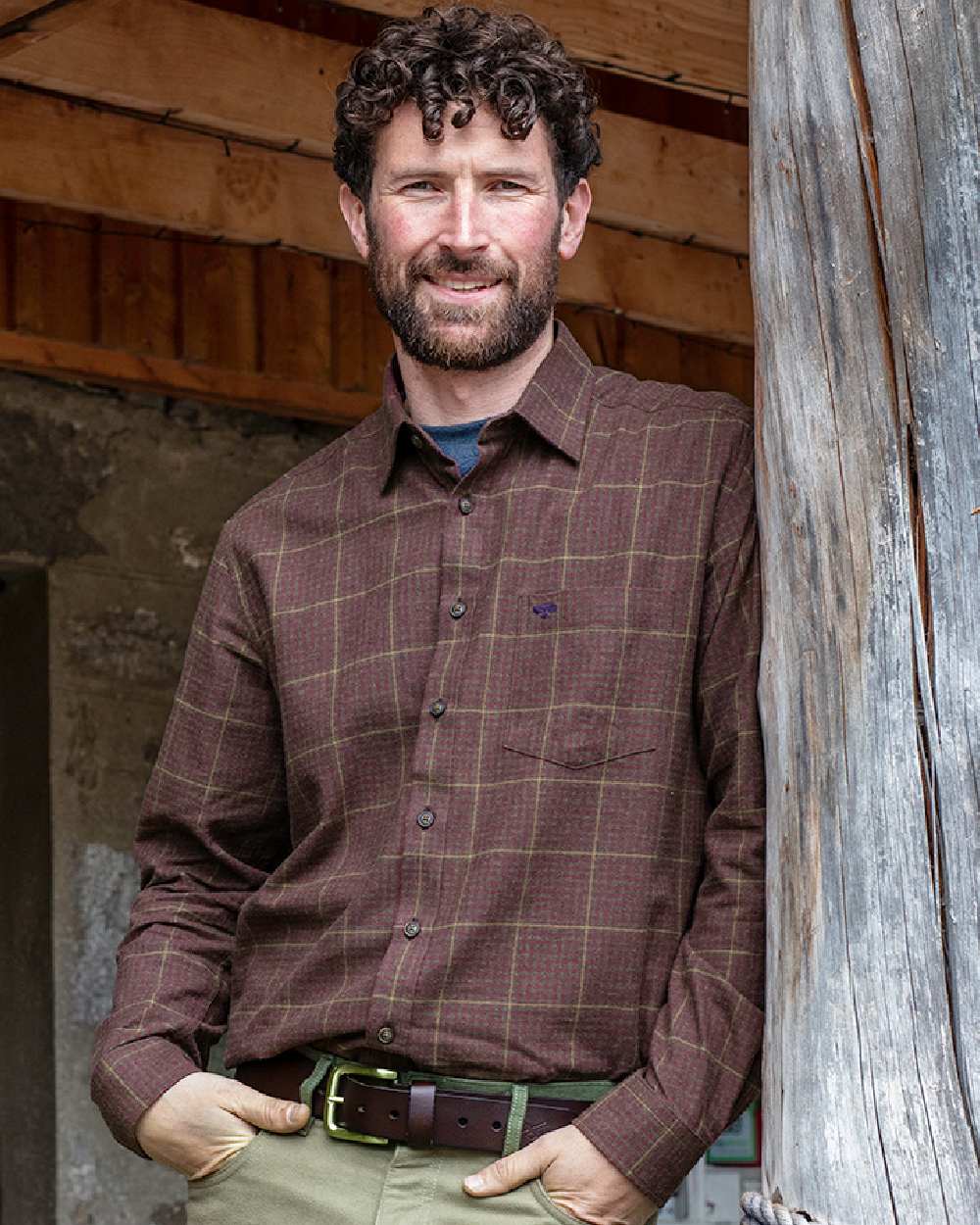 Rust Coloured Hoggs of Fife Harris Cotton Twill Check Shirt on wall background #colour_rust