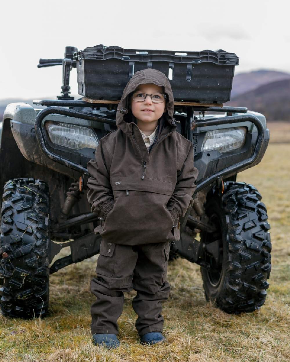 Dark Green Coloured Hoggs of Fife Junior Struther Waterproof Smock on tractor background #colour_dark-green