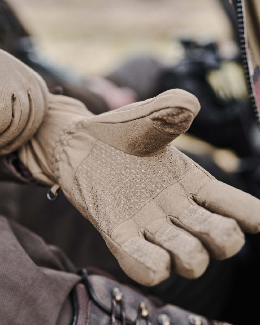 Dark Green Coloured Hoggs of Fife Kinross Waterproof Gloves on blurry background #colour_dark-green