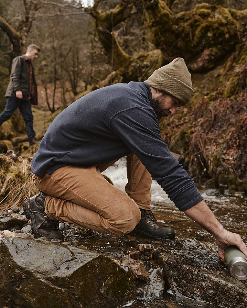Olive coloured Hoggs of Fife Knitted Thinsulate Waterproof Beanie on mountain background #colour_olive