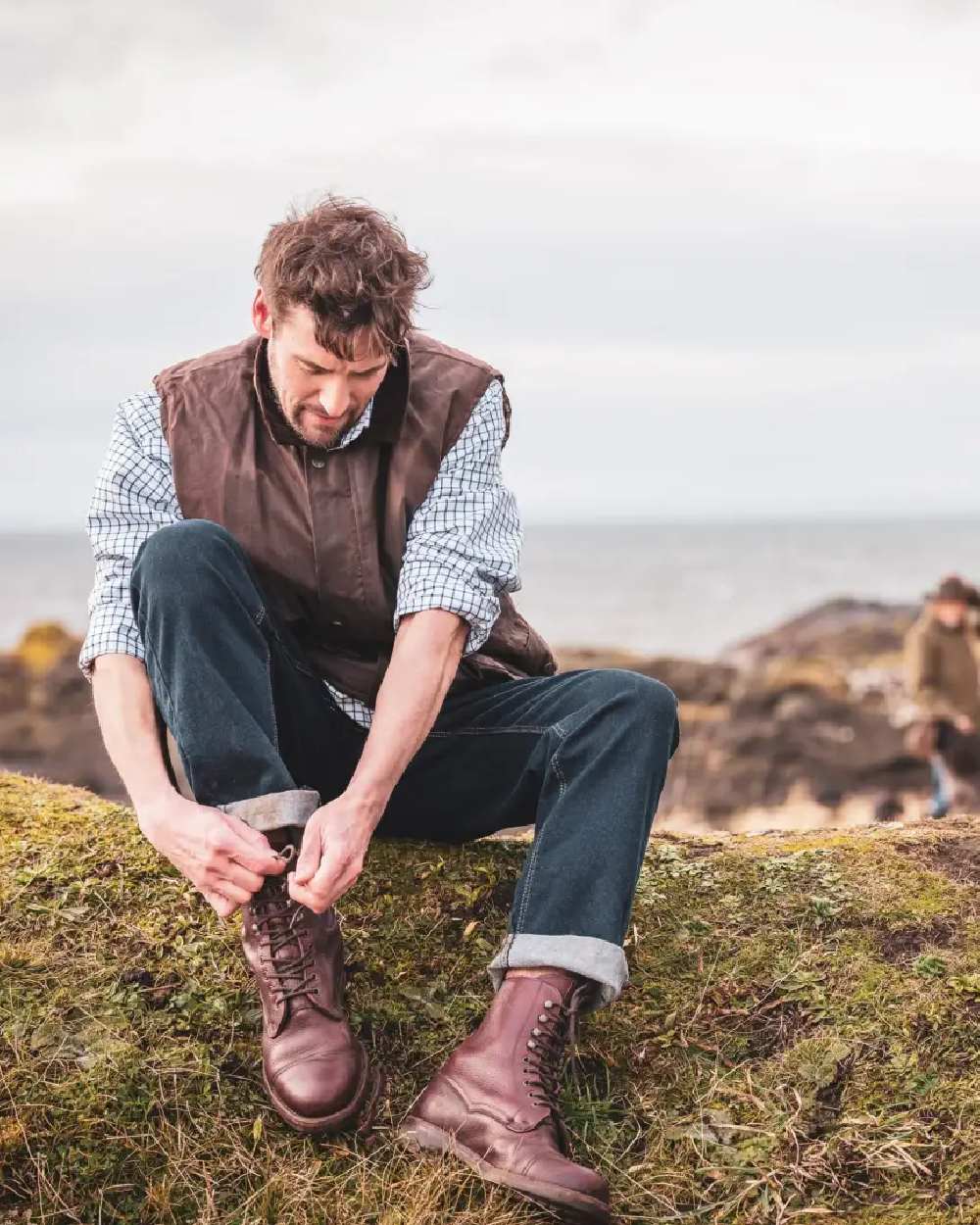 Chocolate Coloured Hoggs of Fife Lomond II Leather Waistcoat on sky background #colour_chocolate