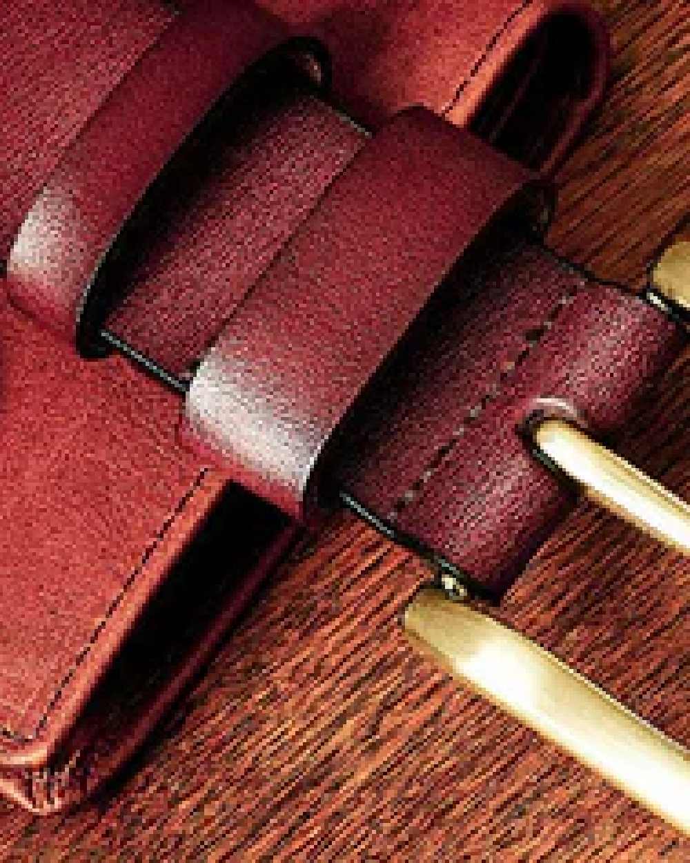 Tan Coloured Hoggs of Fife Luxury Leather Belts on wood background #colour_tan