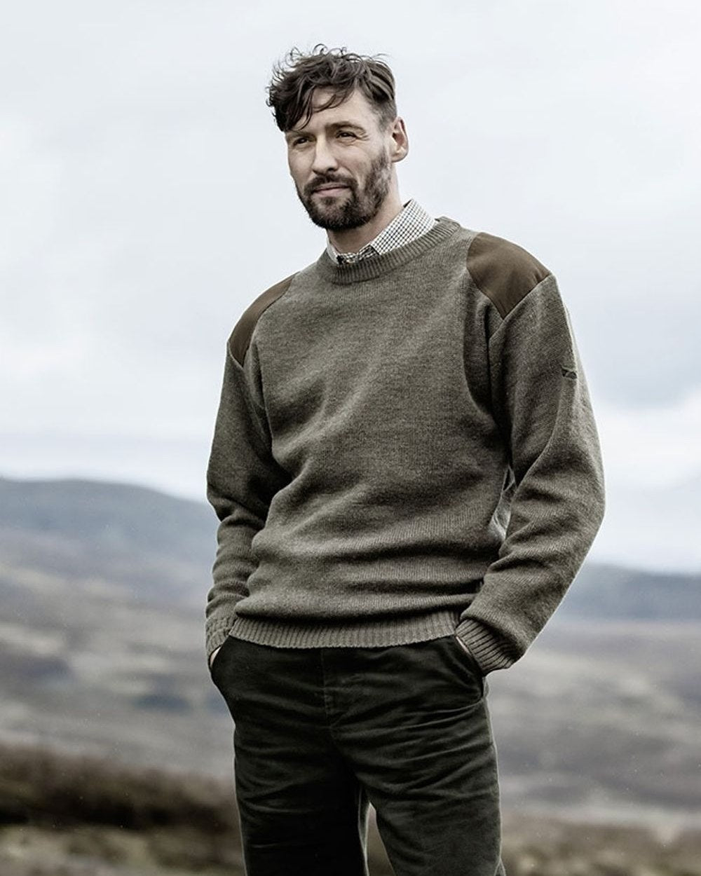Marled Green Coloured Hoggs of Fife Melrose Hunting Pullover on mountain background #colour_marled-green