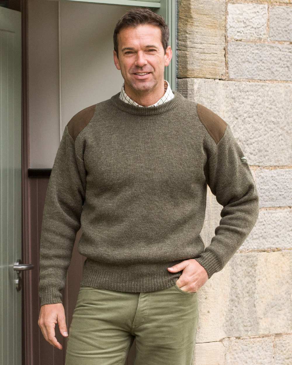 Marled Green Coloured Hoggs of Fife Melrose Hunting Pullover on door background #colour_marled-green