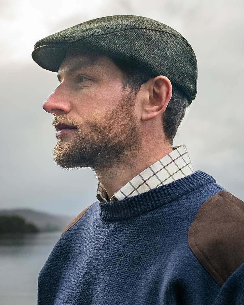 Marled Navy Coloured Hoggs of Fife Melrose Hunting Pullover on sea background #colour_marled-navy