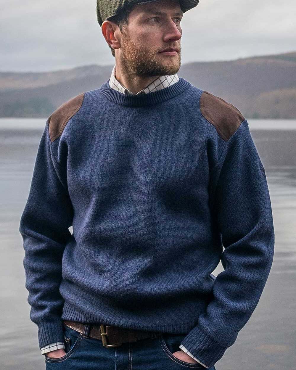 Marled Navy Coloured Hoggs of Fife Melrose Hunting Pullover on sea background #colour_marled-navy