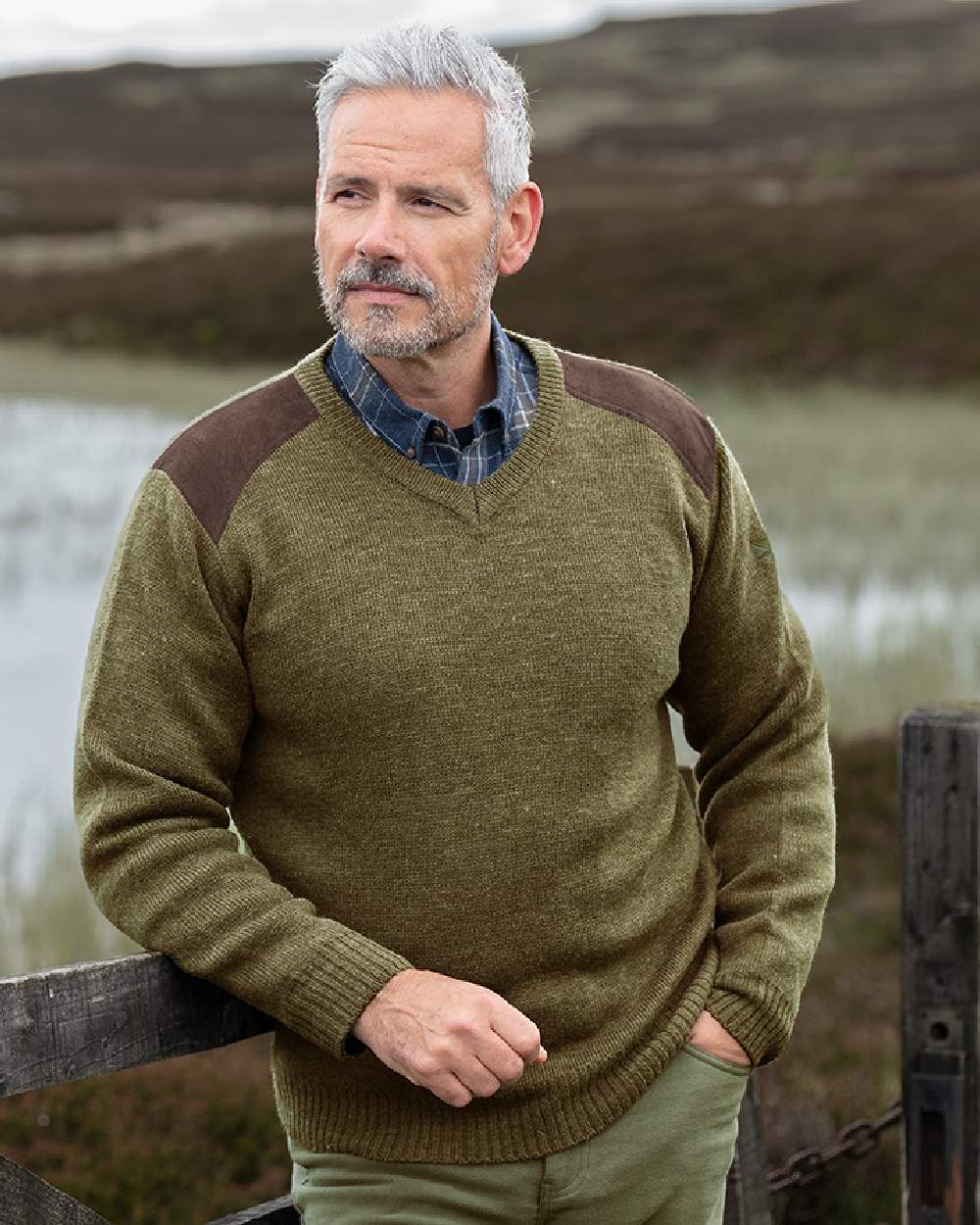 Meadow Green coloured Hoggs of Fife Melrose II V Neck Pullover on pond background #colour_meadow-green