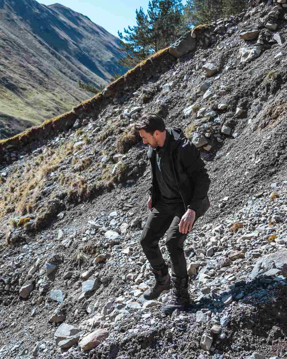 Green Coloured Hoggs of Fife Mens Ardross 4 Way Active Trousers on mountain background #colour_green