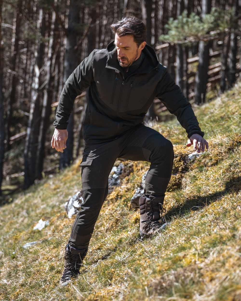 Green Coloured Hoggs of Fife Mens Ardross 4 Way Active Trousers on mountain background #colour_green