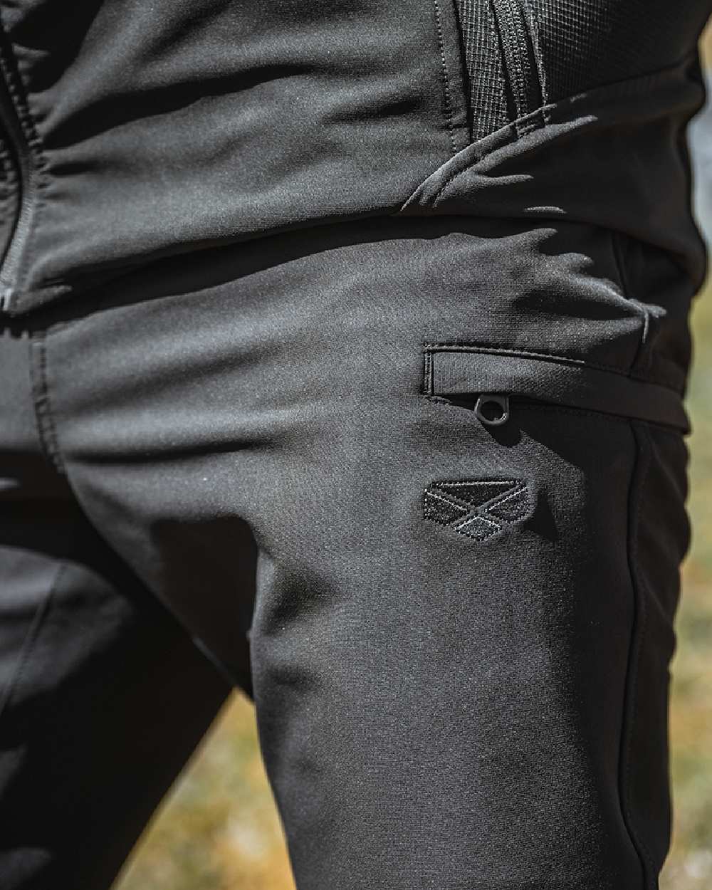 Green Coloured Hoggs of Fife Mens Ardross 4 Way Active Trousers on blurry background #colour_green