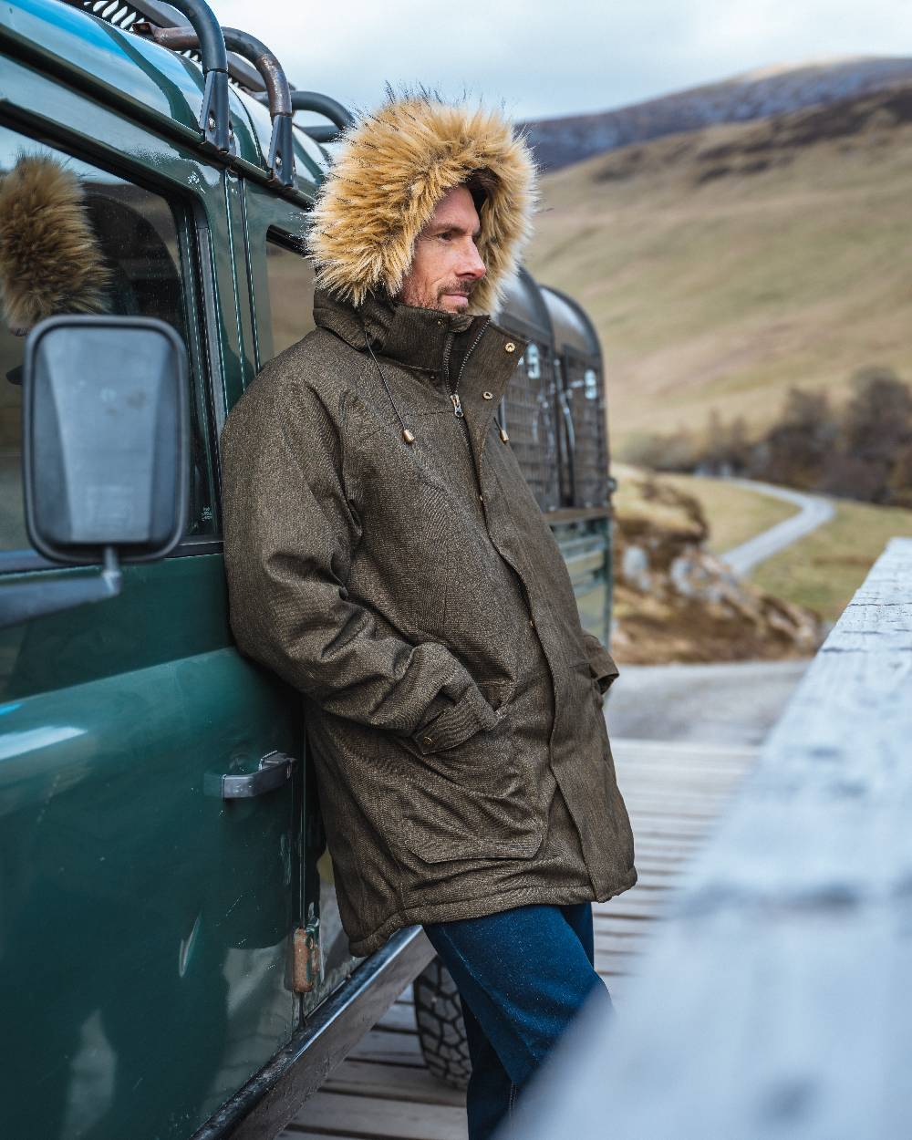 Forest Green coloured Hoggs of Fife Mens Argyll II Jacket on mountain background #colour_forest-green