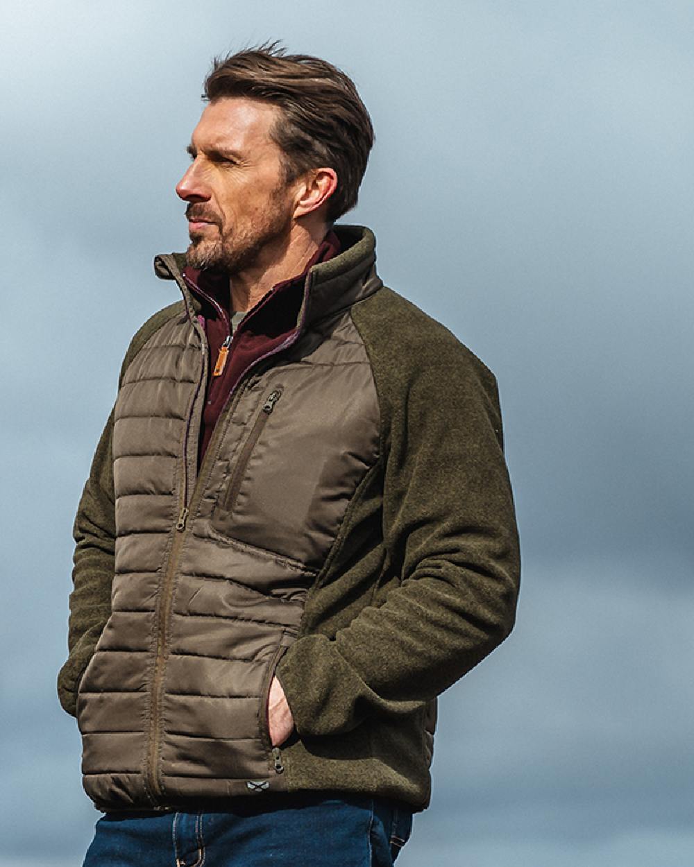 Dark Forest Marl Coloured Hoggs of Fife Mens Melville Hybrid Jacket on sky background #colour_dark-forest-marl