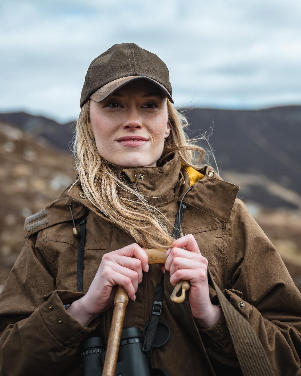 Field Green Coloured Hoggs of Fife Rannoch Ladies Hunting Jacket on mountain background #colour_field-green