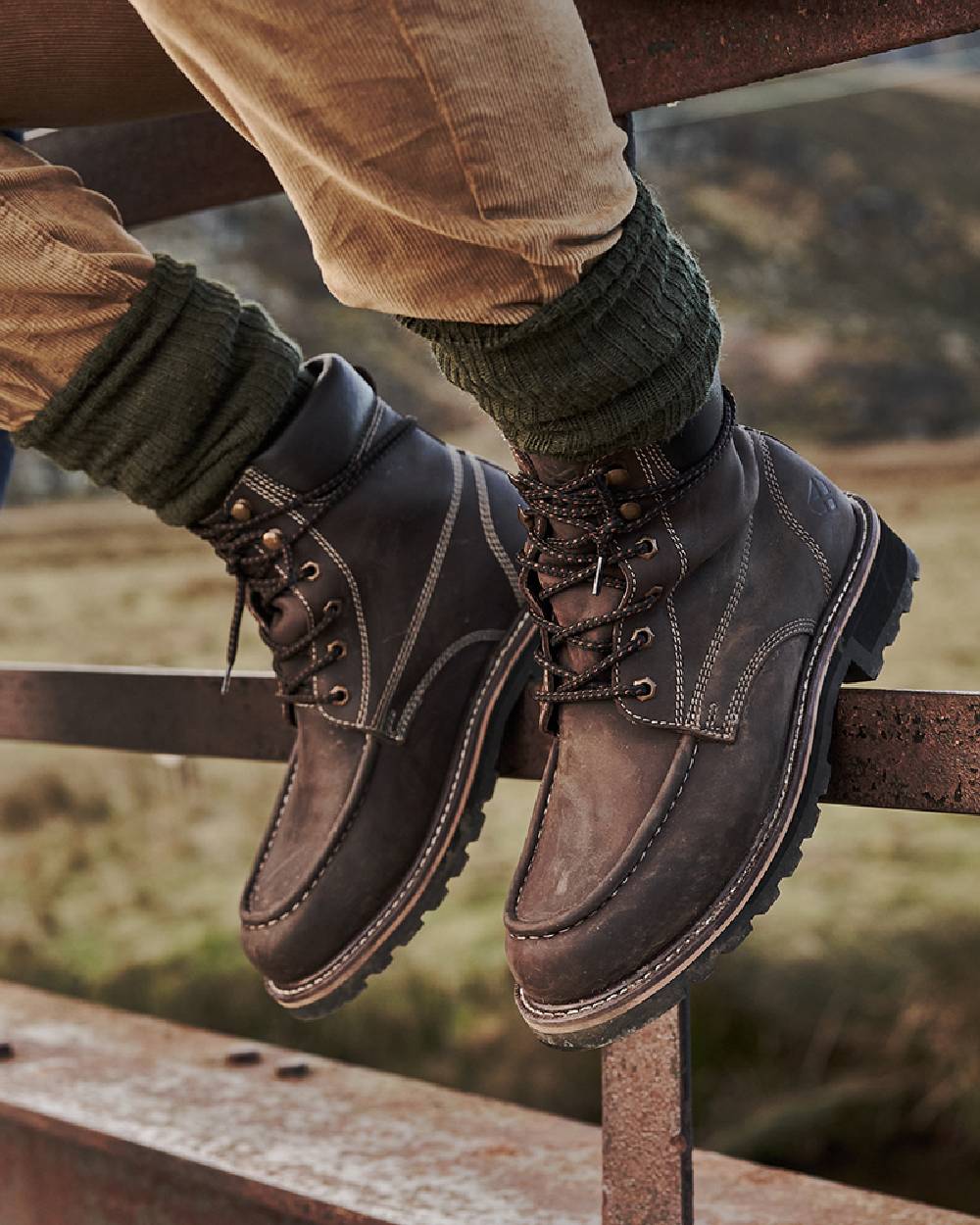 Oak Brown Coloured Hoggs of Fife Selkirk Moc Work Boots on countryside background #colour_oak-brown
