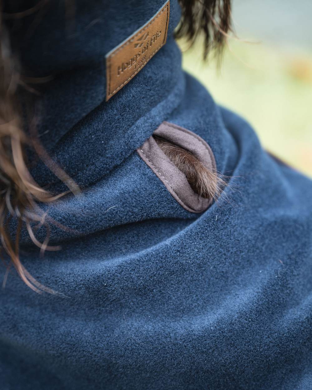 Navy Coloured Hoggs of Fife Stenton Fleece Dog Coat on blurry background #colour_navy