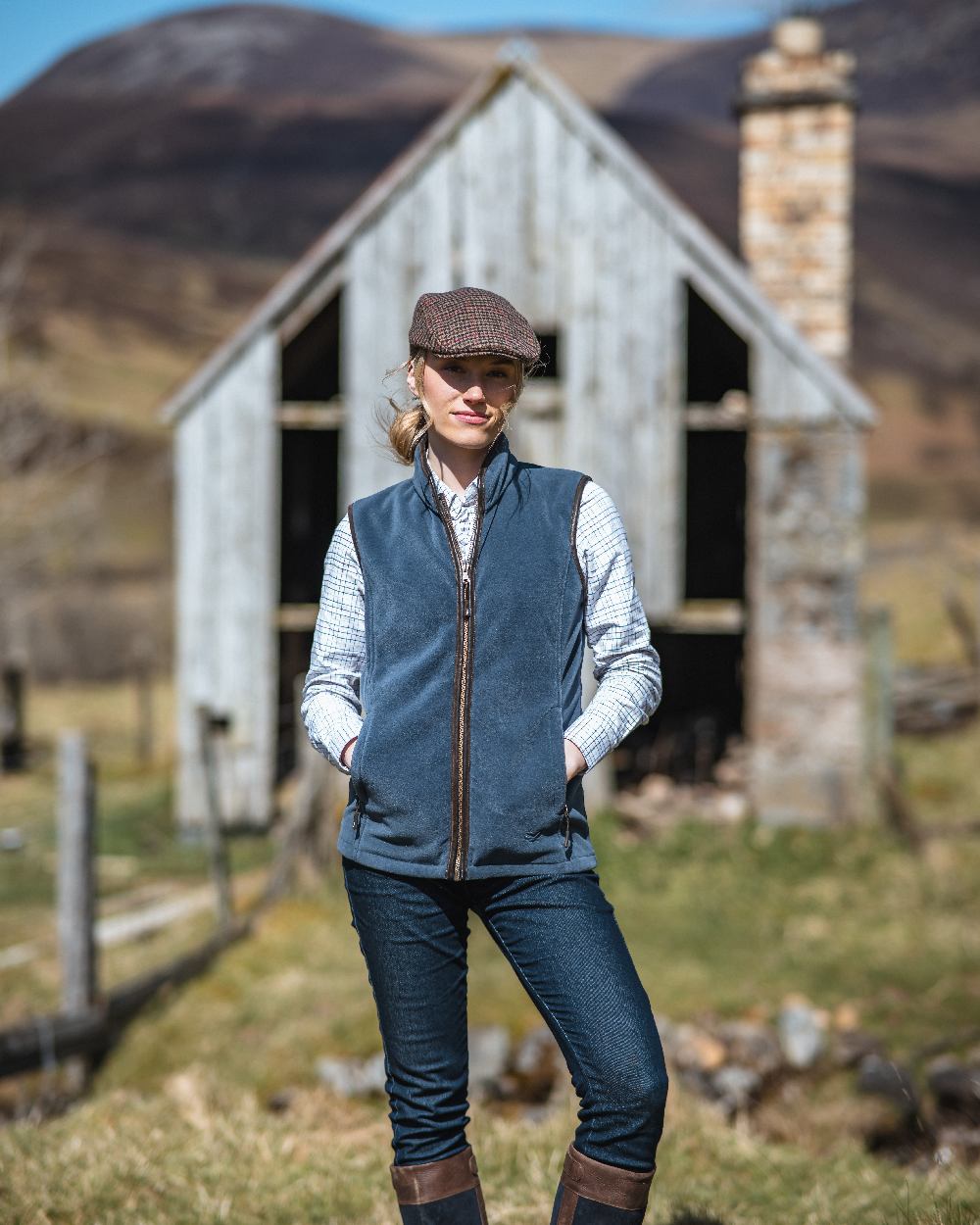 Slate Grey Coloured Hoggs of Fife Stenton Ladies Fleece Gilet on countryside background #colour_slate-grey