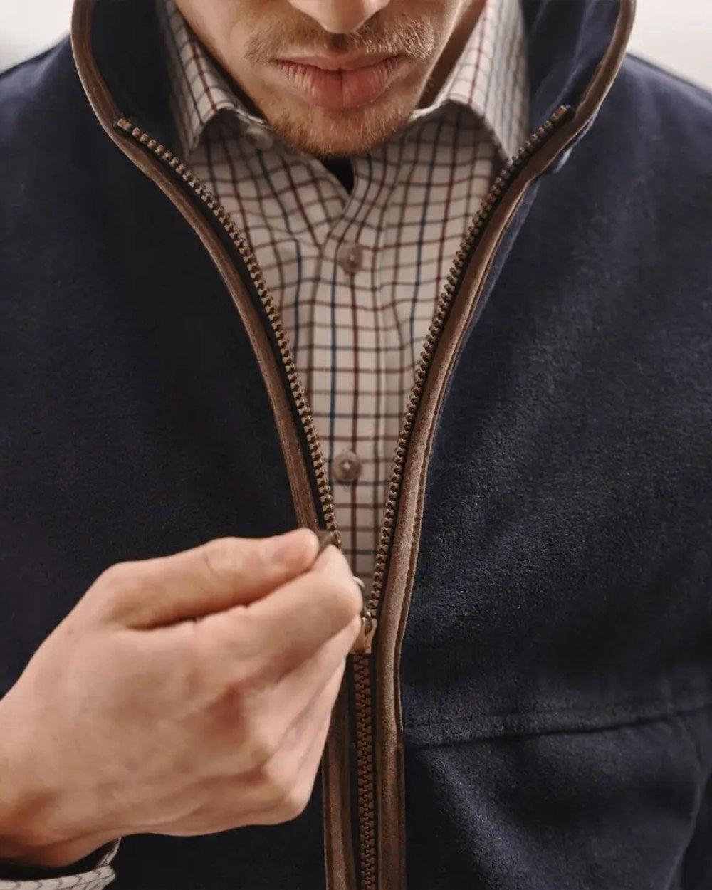 Midnight Navy coloured Hoggs of Fife Stenton Technical Fleece Gilet on blurry background #colour_midnight-navy