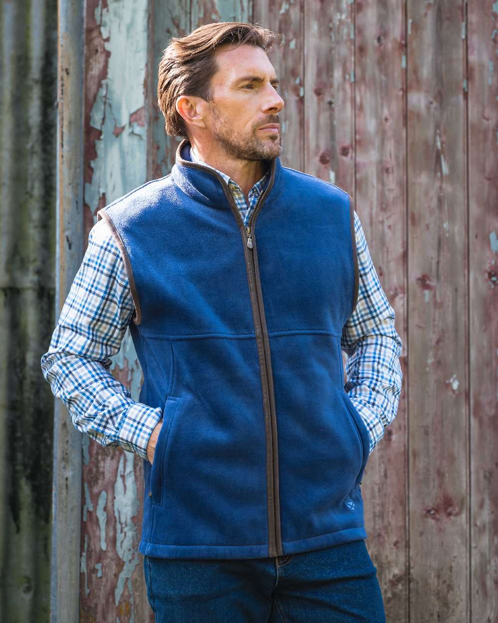 Nordic Blue coloured Hoggs of Fife Stenton Technical Fleece Gilet on forest background #colour_nordic-blue