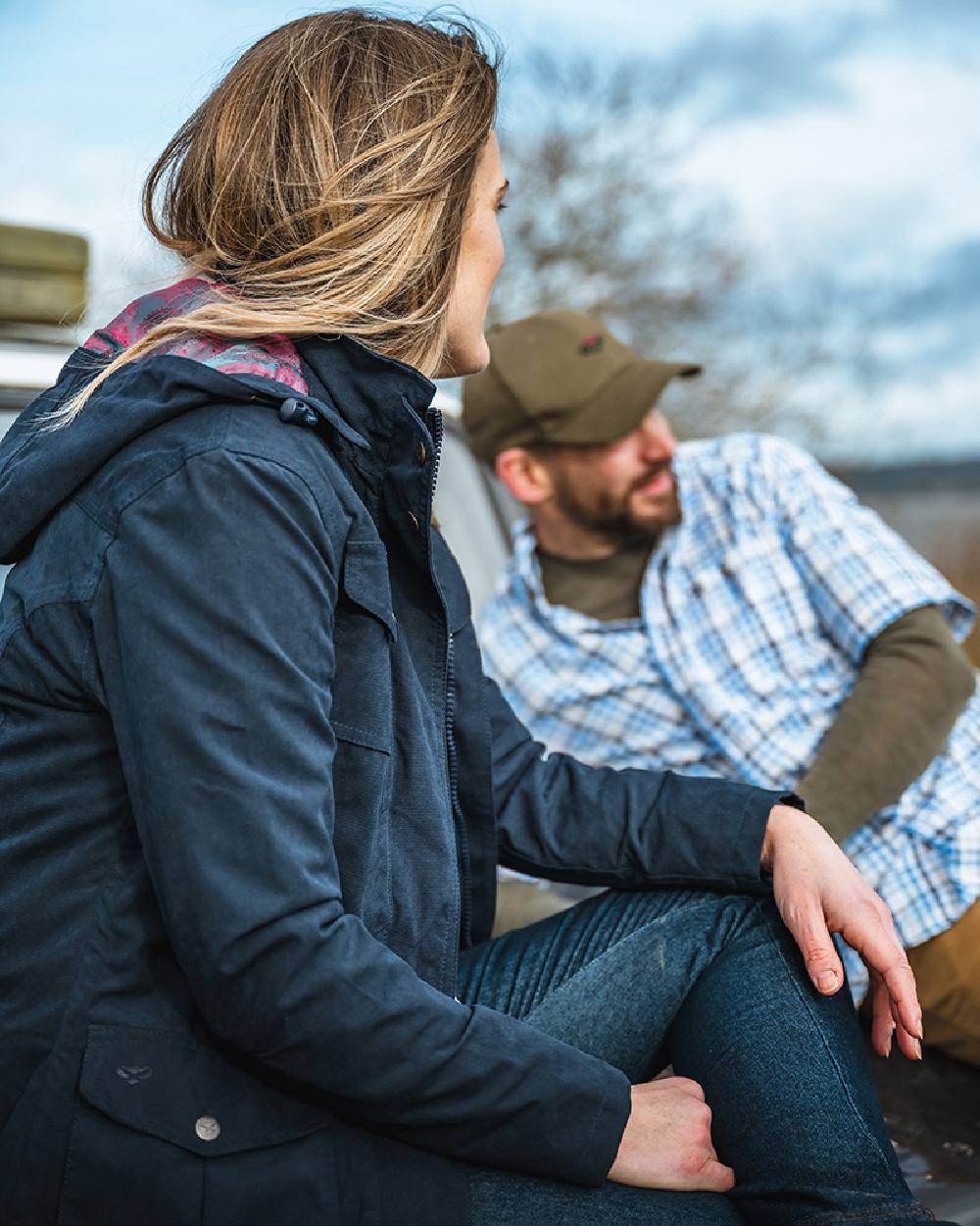 Navy Coloured Hoggs of Fife Struther Ladies Hooded Field Coat on blurry background #colour_navy