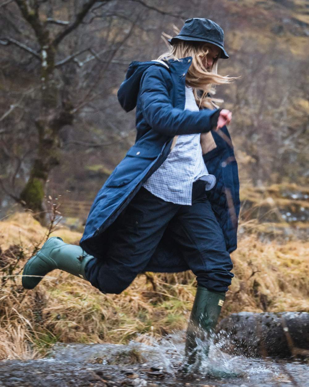 Navy Coloured Hoggs of Fife Waxed Bush Hat on forest background #colour_navy