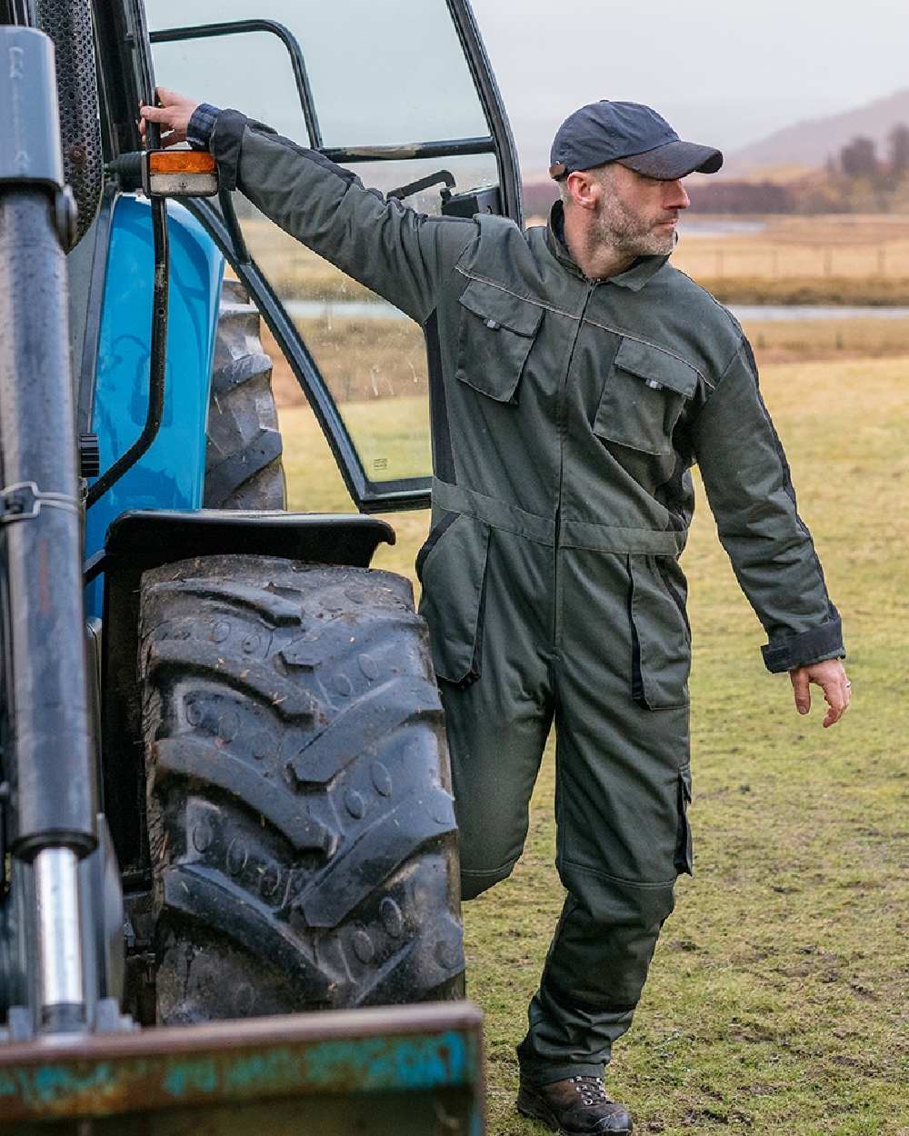 Spruce Black Coloured Hoggs of Fife Workhogg Zipped Cotton Coverall on countryside background #colour_spruce-black