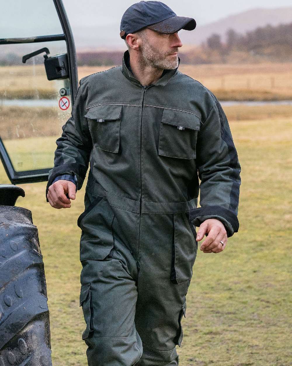 Spruce Black Coloured Hoggs of Fife Workhogg Zipped Cotton Coverall on countryside background #colour_spruce-black