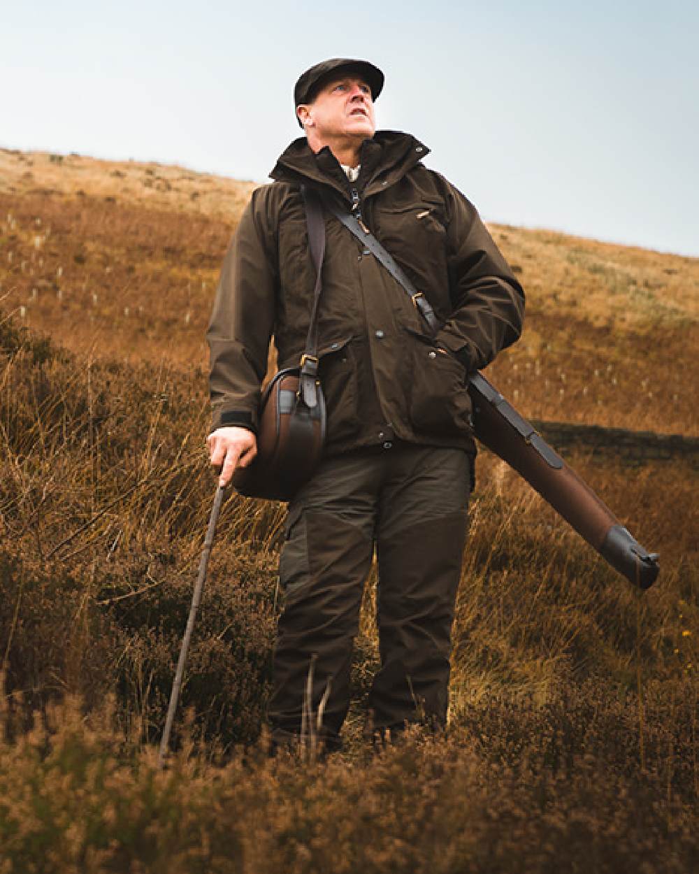 Olive coloured Jack Pyke Ashcombe Jacket on grassy background #colour_olive